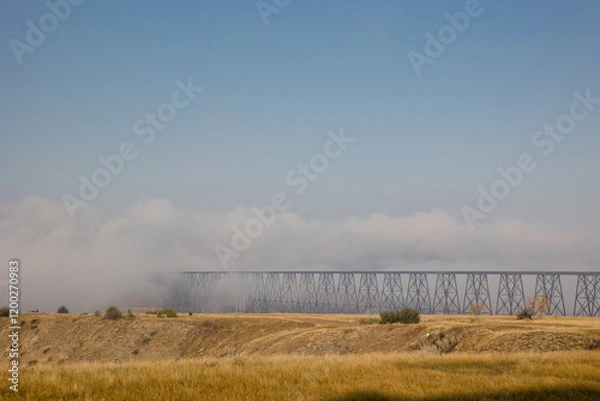Fototapeta High level bridge in Lethbridge, Alberta covered in a morning fog