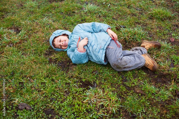 Obraz Boy lying on grass