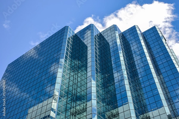 Fototapeta The glass skyscrapper reflecting the clouds in Ottawa downtown