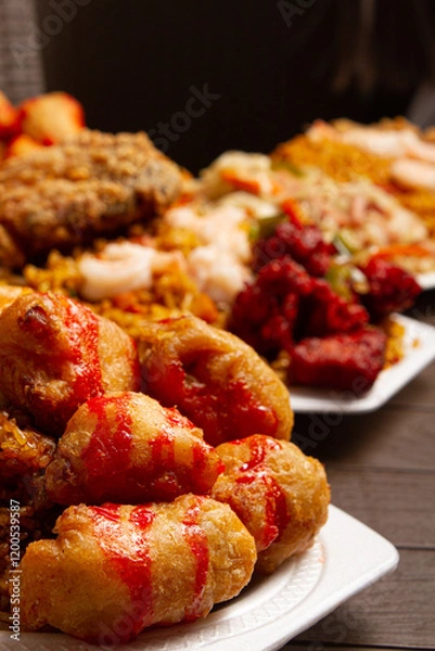 Fototapeta dish of sweet and sour chicken, Chinese rice and Chinese style fried chicken on brown table