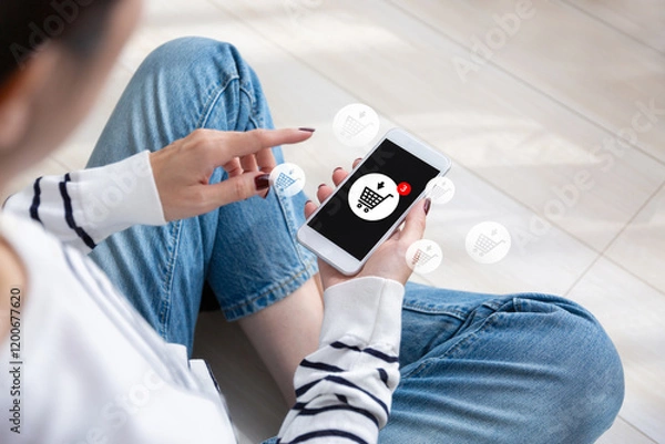 Obraz スマホでネットショッピングをする女性