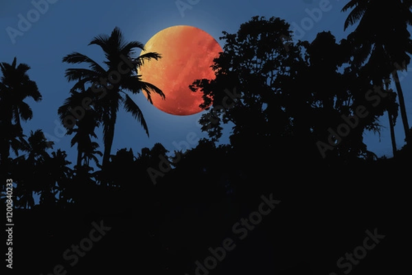 Fototapeta Mysterious blood moon image with silhouette trees in deep jungle on Halloween night background.