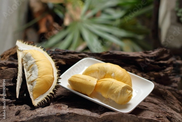 Fototapeta Durian in a white plate on a wooden background