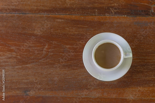 Fototapeta Retro style or Vintage Style,  Coffee cup Put on a stump or wood table in the garden sunny morning.