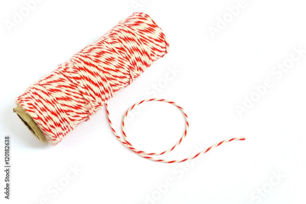 Fototapeta Roll of red and white rope on white background