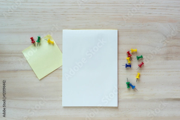 Fototapeta Open notebook and sticky note on wooden background.