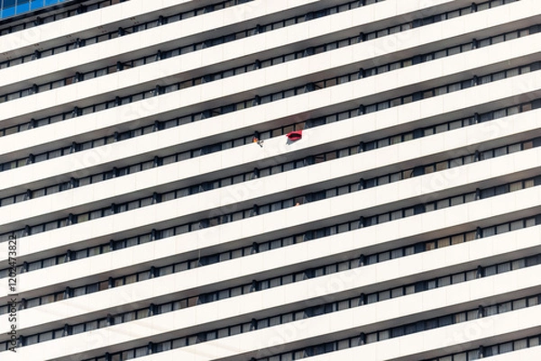 Obraz A red blanket disrupts the rhythm of the balconies