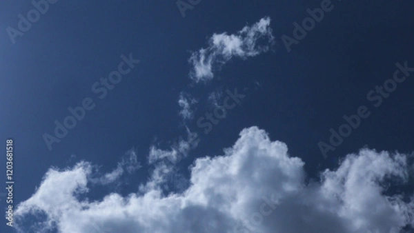 Obraz White clouds scattered in the blue sky