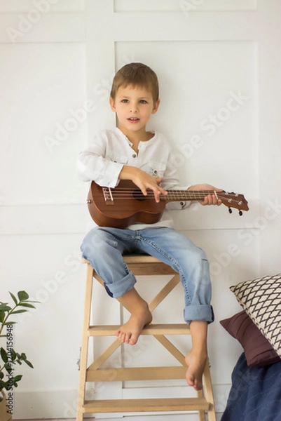 Obraz child playing guitar