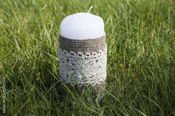 Obraz decorative candle in grass