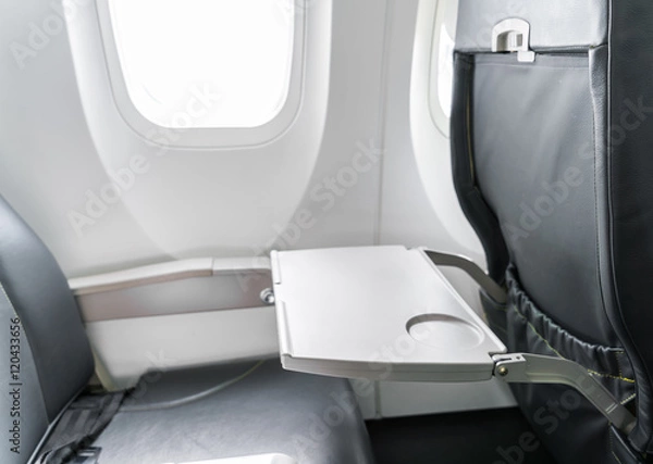 Fototapeta Airplane tray table on seat back .