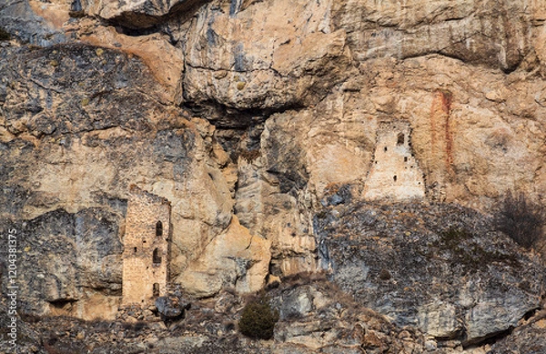 Fototapeta Ancient defensive towers in the cliffs in the mountains of Caucasus. Cmiti, North Ossetia, Russia