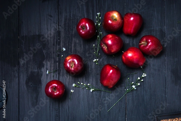 Fototapeta Red apple on the dark table