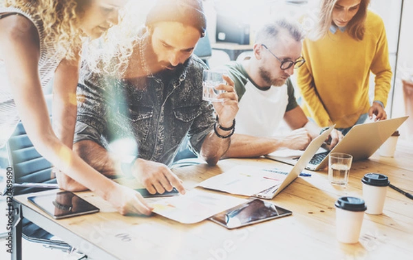 Fototapeta Startup Diversity Teamwork Brainstorming Meeting Concept.Business Team Coworkers Sharing World Economy Report Document Laptop.People Working Planning Start Up.Group Young Hipsters Discussing Cafe.
