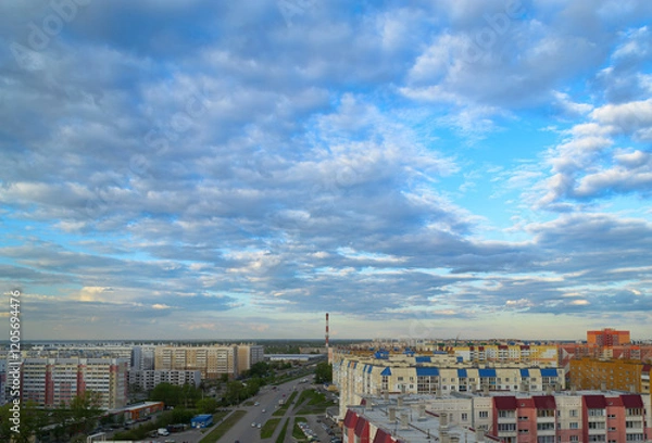 Obraz Top view of the town with many multi-storey buildings under a cloudy sky
