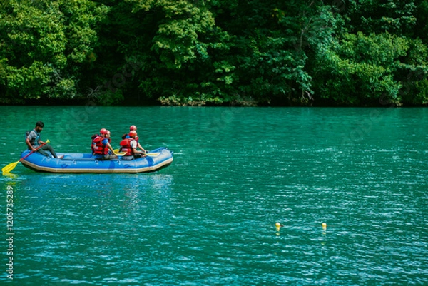 Fototapeta Dandeli, Karnataka- 6th december 2024-Young Indian tourists are rafting on the river in Dandeli, India.