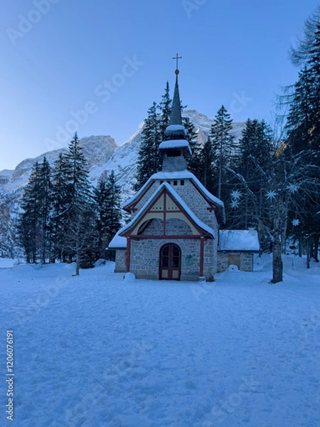 Fototapeta Lake Braies, Italy. View of the Chapel during winter season. Snow around the Chapel. Iconic destination