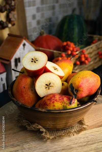 Fototapeta RED WILLIAM PEARS whole fruit and cut in half in a bowle. Known for its stunning deep red skin and soft, buttery texture. These sweet pears have red freckles, reminiscent of a Rainbow trout's skin