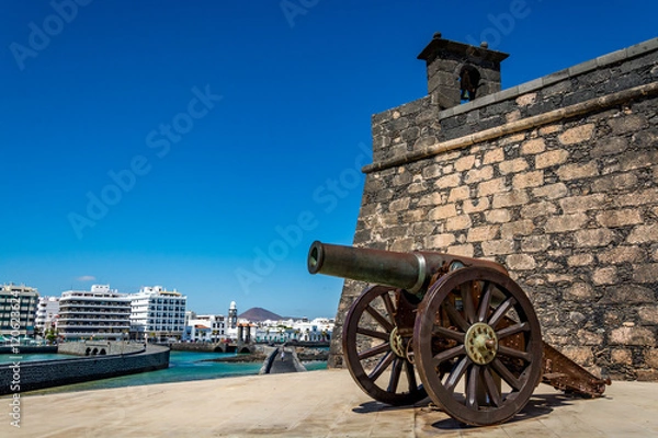 Obraz Castillo de San Gabriel - Saint Gabriel Castle in Arrecife and a cannon in front of it, Lanzarote island, Spain 