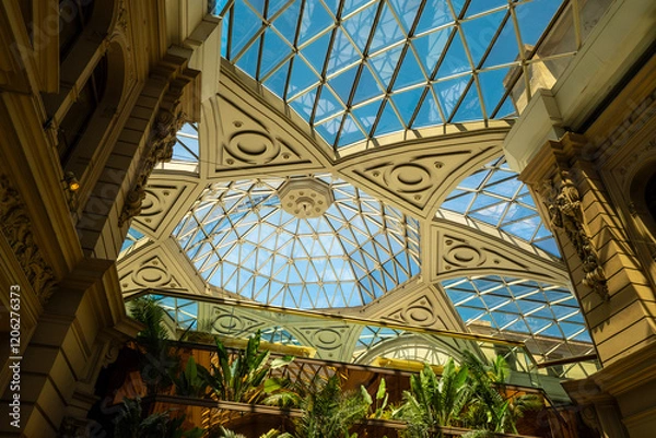 Fototapeta A large building with a dome on top and a glass ceiling