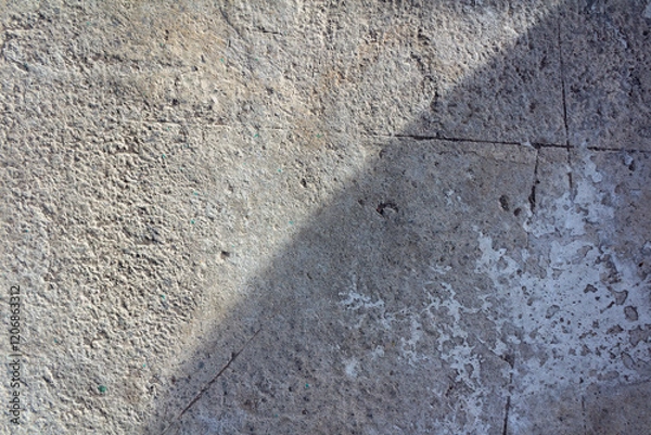 Fototapeta Abstract Sunlight Shadows on Rough Concrete Surface