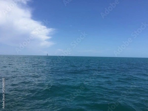 Obraz storm clouds over the ocean and an island
