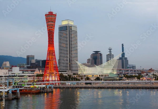 Fototapeta Kobe Port tower and maritime museum in the port of Kobe illuminated at dusk