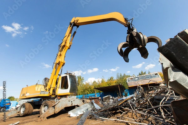 Obraz Excavator for loading scrap metal.