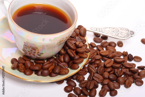 Fototapeta Coffee beans with a cup of black coffee
