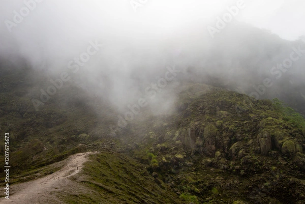 Obraz Cloudy sky over the rocky mountain