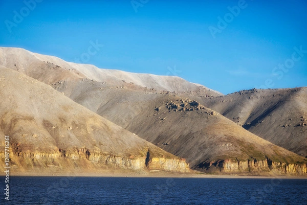 Fototapeta The beautiful banks of the Siberian river Lena are reflected in the water