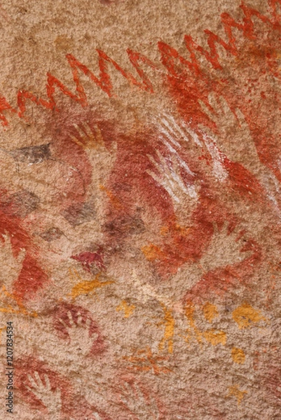 Fototapeta Vertical Image of Rock ledge on Rio Pinturas where famous rock paintings of handprints and animals are located. Location: Cueva de las Manos, UNESCO World Heritage Site, Patagonia, Argentina