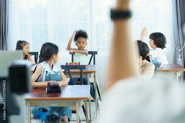 Fototapeta Group of diverse children enjoy learning about the STEM.