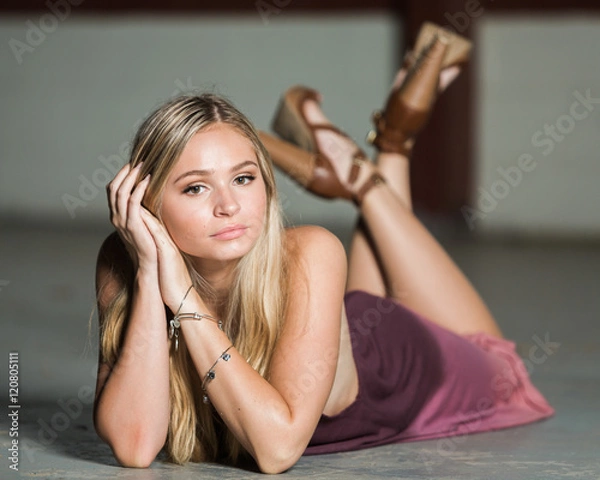 Fototapeta High school senior poses for portraits