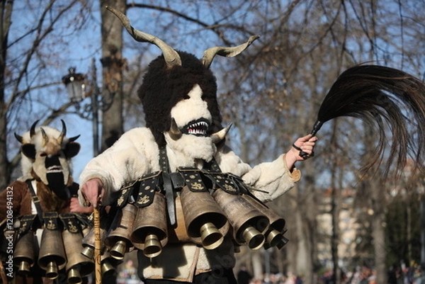 Obraz The Surva masquerade games festival in Sofia, Bulgaria. People called Kukeri parade in masks and ritual costumes, perform ritual dances to drive away evil spirits in Sofia, Bulgaria