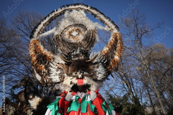 Obraz The Surva masquerade games festival in Sofia, Bulgaria. People called Kukeri parade in masks and ritual costumes, perform ritual dances to drive away evil spirits in Sofia, Bulgaria