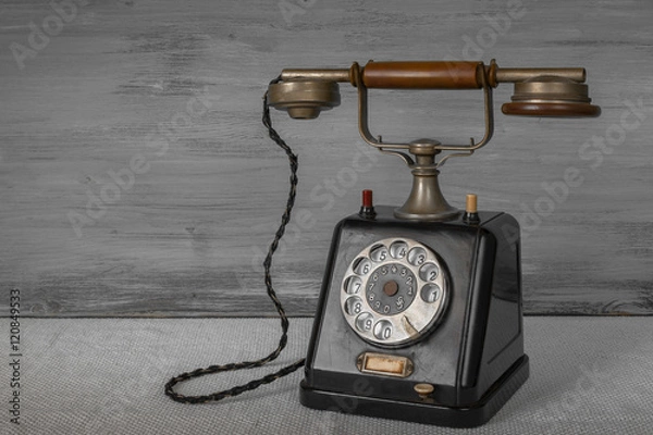 Fototapeta Old black telephone
