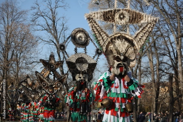 Obraz The Surva masquerade games festival in Sofia, Bulgaria. People called Kukeri parade in masks and ritual costumes, perform ritual dances to drive away evil spirits in Sofia, Bulgaria