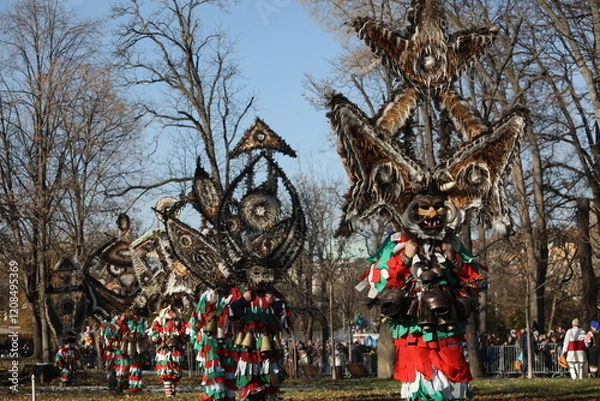 Obraz The Surva masquerade games festival in Sofia, Bulgaria. People called Kukeri parade in masks and ritual costumes, perform ritual dances to drive away evil spirits in Sofia, Bulgaria