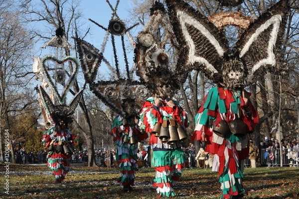 Obraz The Surva masquerade games festival in Sofia, Bulgaria. People called Kukeri parade in masks and ritual costumes, perform ritual dances to drive away evil spirits in Sofia, Bulgaria