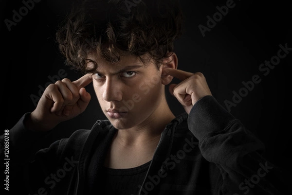 Obraz headstrong boy on black background