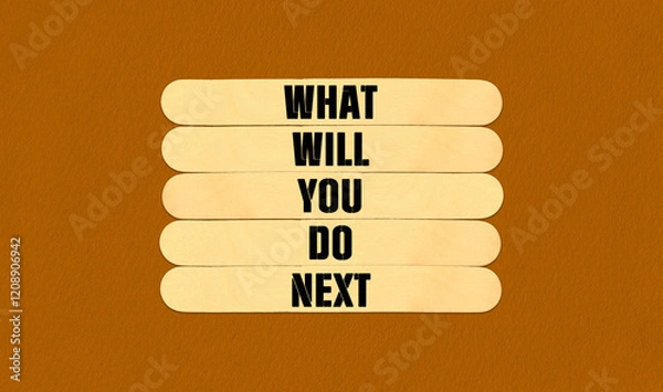Fototapeta What Will You Do Next Symbol. Concept word What Will You Do Next on beautiful wooden stick. Beautiful Orange Chart Paper Background. Business and What Will You Do Next concept. Copy space