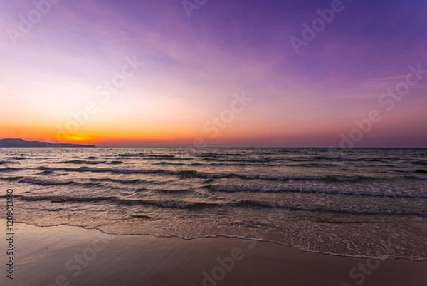Fototapeta Beautiful sea and sky with calm waves in summer after sunset with twilight light