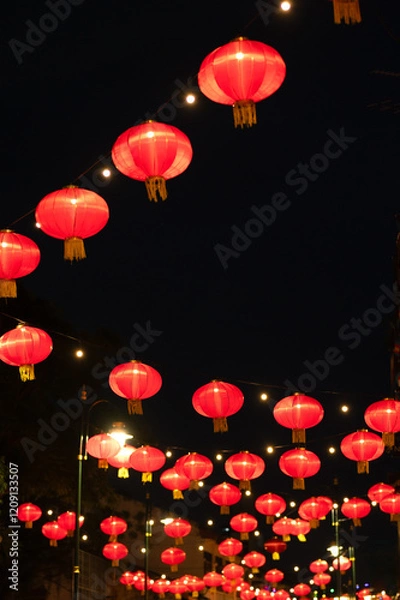 Fototapeta Lanterns of Chinese New Year in the night. Abstract Bokeh background