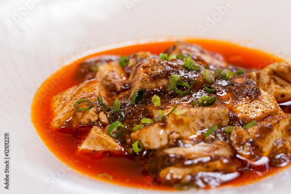Fototapeta Chinese Sichuan Chenmapo tofu with sauce on white plate backgrou