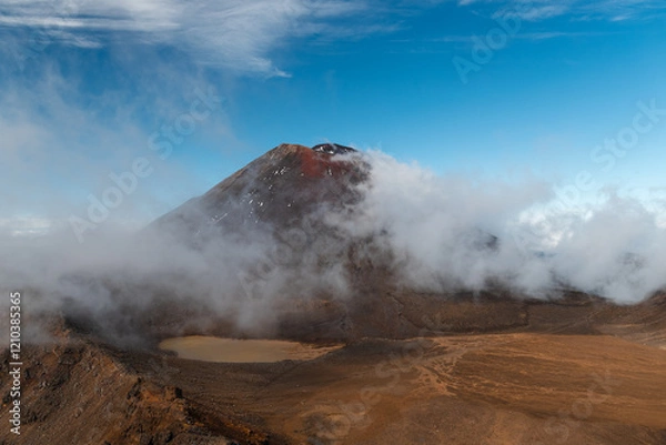 Obraz View of volcano Mount Ngauruhoe with fog rolling over the mountain and crystal clear sky (Tongariro Crossing, North Island, New Zealand)