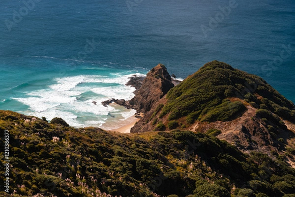 Obraz View of coastline near Cape Reinga Lighthouse (New Zealand's northern most point) with clear water and blue sky (North Island, New Zealand)