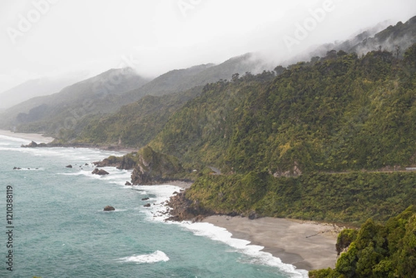 Obraz View of western shoreline of Nea Zealand's South Island as seen after a rainshower with crashing waves and rolling clouds (New Zealand)
