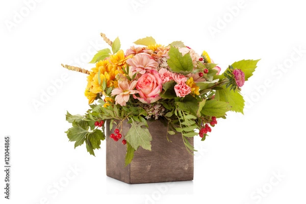 Fototapeta Autumn flower bouquet with berries and apple in wooden box