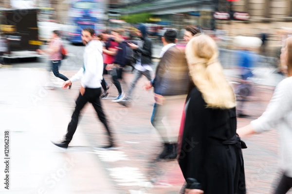 Fototapeta crowd of people crossing a street with zoom effect